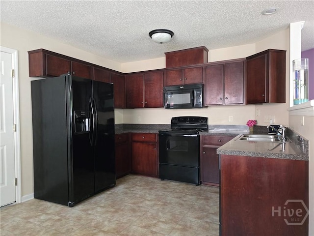182 Gloucester Dr, Midway, GA 31320 - kitchen with black appliances, a sink, dark countertops, and a textured ceiling
