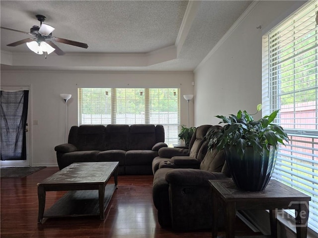 182 Gloucester Dr, Midway, GA 31320 - living room with healthy amount of natural light, a textured ceiling, ornamental molding, wood finished floors, and a ceiling fan