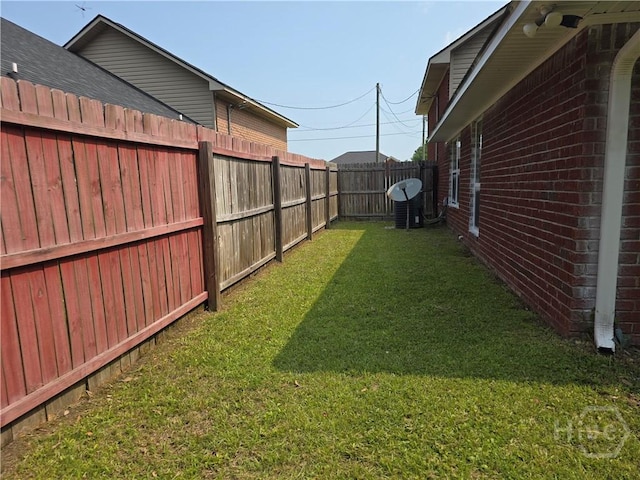 182 Gloucester Dr, Midway, GA 31320 - view of yard featuring central AC unit