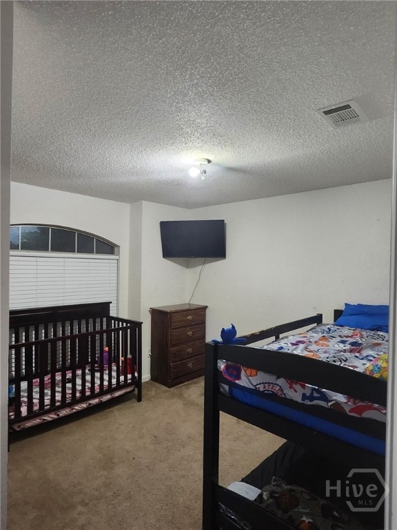 182 Gloucester Dr, Midway, GA 31320 - carpeted bedroom with a textured ceiling