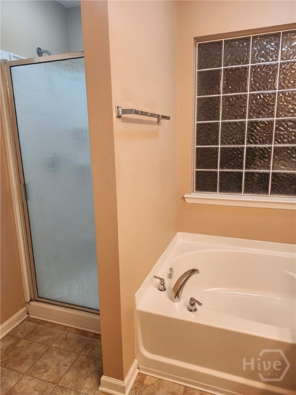 182 Gloucester Dr, Midway, GA 31320 - full bath with a shower stall and a bath