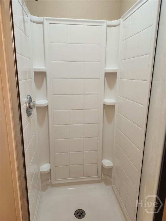 182 Gloucester Dr, Midway, GA 31320 - bathroom featuring a shower stall