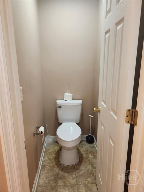 182 Gloucester Dr, Midway, GA 31320 - bathroom featuring baseboards and tile patterned floors