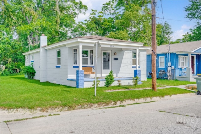 1515 Vine St, Savannah, GA 31401 - view of front of property featuring a porch, a chimney, and a front yard