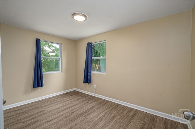 1515 Vine St, Savannah, GA 31401 - spare room featuring wood finished floors, plenty of natural light, and baseboards