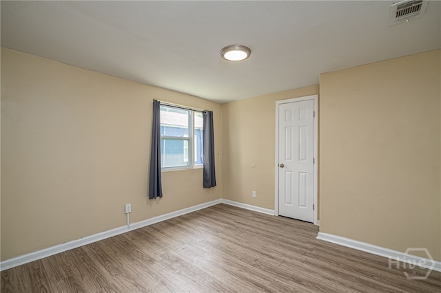 1515 Vine St, Savannah, GA 31401 - unfurnished room with wood finished floors and baseboards