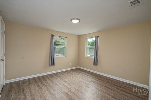 1515 Vine St, Savannah, GA 31401 - empty room featuring wood finished floors and baseboards
