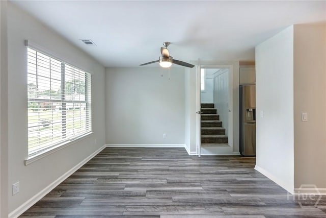 106 Oyster Catcher Ln, Savannah, GA 31410 - unfurnished room with ceiling fan, stairway, wood finished floors, and baseboards