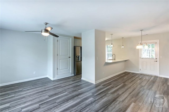 106 Oyster Catcher Ln, Savannah, GA 31410 - unfurnished living room with dark wood-type flooring, a sink, healthy amount of natural light, and ceiling fan