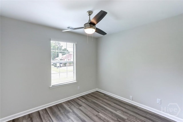 106 Oyster Catcher Ln, Savannah, GA 31410 - spare room featuring dark wood-type flooring, baseboards, and a ceiling fan
