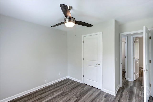 106 Oyster Catcher Ln, Savannah, GA 31410 - unfurnished bedroom with dark wood-style floors, baseboards, and ceiling fan