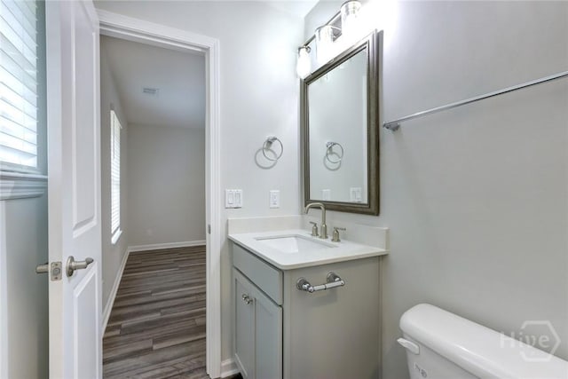 106 Oyster Catcher Ln, Savannah, GA 31410 - bathroom with toilet, vanity, wood finished floors, and baseboards