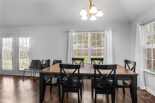 105 W Tisbury Ln, Pooler, GA 31322 - dining space featuring a chandelier, dark wood-style floors, vaulted ceiling, and baseboards