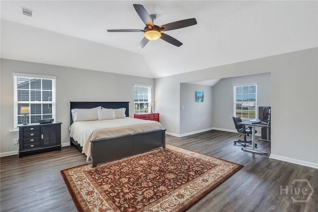 346 Bobwhite Trl NE, Ludowici, GA 31316 - bedroom with dark wood-style flooring, multiple windows, an office area, and vaulted ceiling