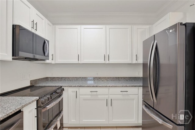 3311 Whitemarsh Way Unit 3311, Savannah, GA 31410 - kitchen with appliances with stainless steel finishes, white cabinetry, ornamental molding, and light stone counters