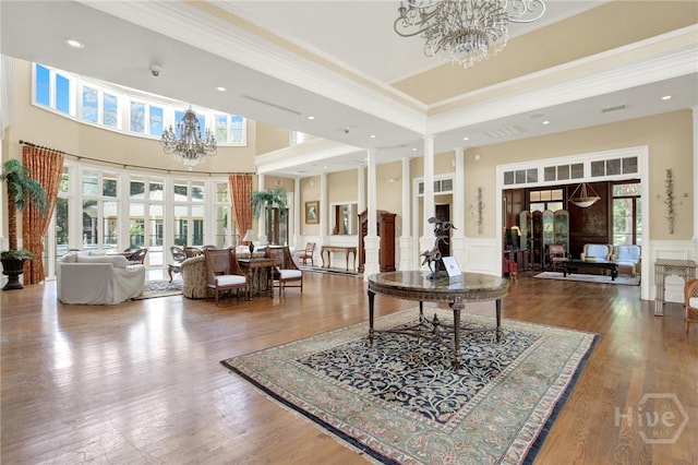 3311 Whitemarsh Way Unit 3311, Savannah, GA 31410 - community lobby with ornamental molding, wainscoting, a decorative wall, a towering ceiling, and a surveillance system