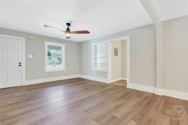 55 Saint Johns Ave, Savannah, GA 31404 - unfurnished room with ceiling fan, wood finished floors, built in features, and baseboards