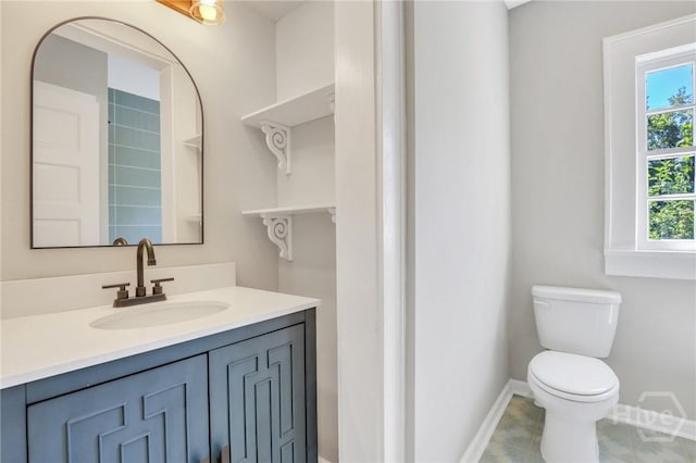 55 Saint Johns Ave, Savannah, GA 31404 - bathroom with toilet, vanity, and baseboards