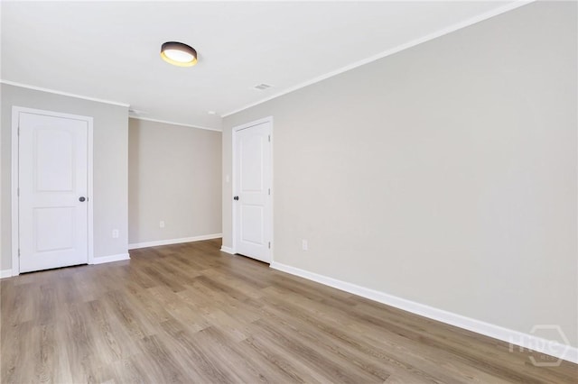 55 Saint Johns Ave, Savannah, GA 31404 - spare room with ornamental molding, light wood finished floors, and baseboards