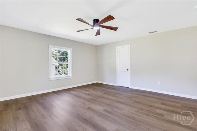 55 Saint Johns Ave, Savannah, GA 31404 - unfurnished room featuring a ceiling fan, wood finished floors, and baseboards