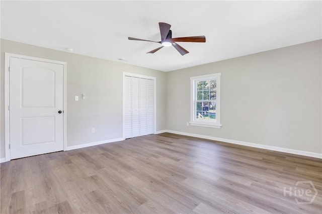 55 Saint Johns Ave, Savannah, GA 31404 - unfurnished bedroom with wood finished floors, a closet, baseboards, and ceiling fan