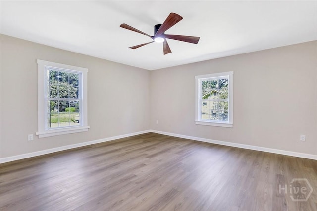 55 Saint Johns Ave, Savannah, GA 31404 - unfurnished room with plenty of natural light, wood finished floors, baseboards, and ceiling fan