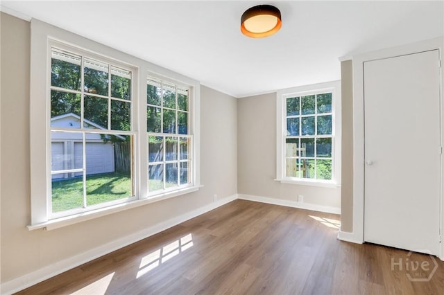 55 Saint Johns Ave, Savannah, GA 31404 - unfurnished room with wood finished floors and baseboards
