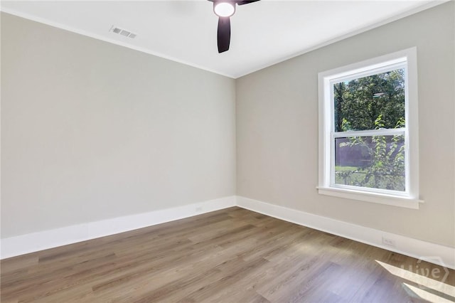 55 Saint Johns Ave, Savannah, GA 31404 - unfurnished room with wood finished floors, baseboards, ceiling fan, and ornamental molding