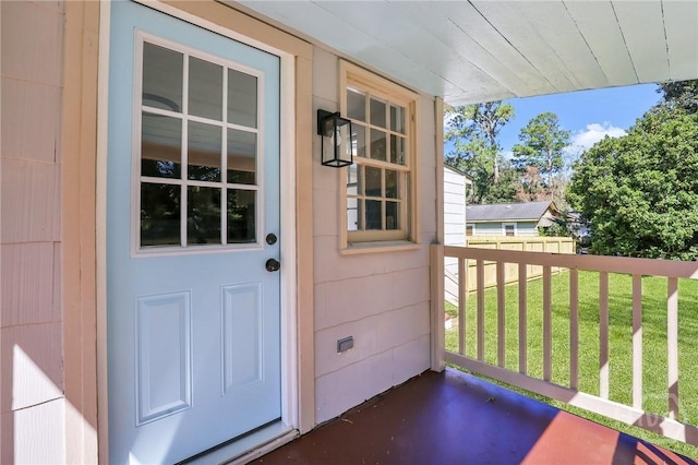 55 Saint Johns Ave, Savannah, GA 31404 - view of exterior entry featuring a yard and covered porch