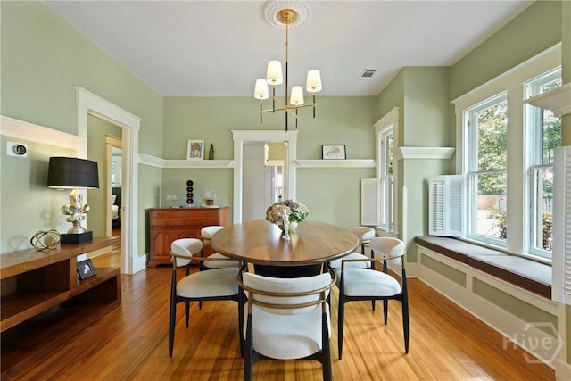 1301 E 48th St, Savannah, GA 31404 - dining room with wood finished floors and a chandelier