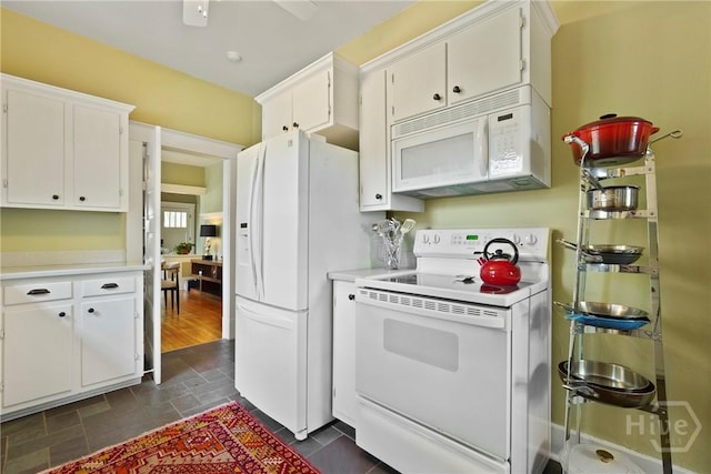 1301 E 48th St, Savannah, GA 31404 - kitchen featuring white appliances, light countertops, and white cabinets