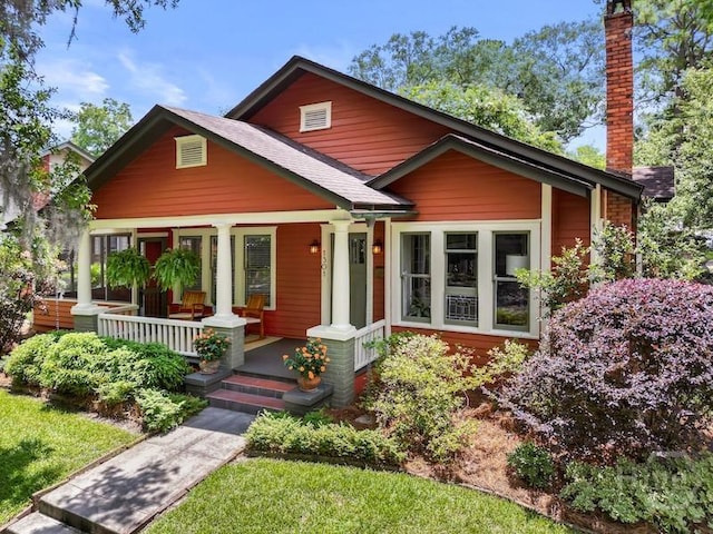 1301 E 48th St, Savannah, GA 31404 - view of front of home with a chimney and covered porch