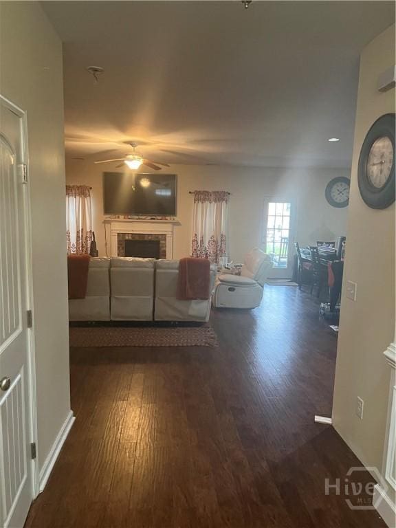 153 Spoonbill Cir, Savannah, GA 31405 - living room featuring a ceiling fan, wood finished floors, a fireplace, and baseboards
