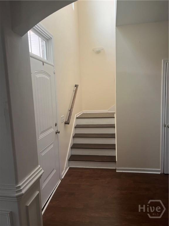 153 Spoonbill Cir, Savannah, GA 31405 - staircase with wood finished floors, baseboards, and arched walkways