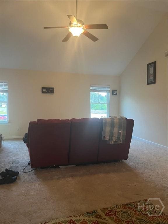 153 Spoonbill Cir, Savannah, GA 31405 - carpeted living room with lofted ceiling, ceiling fan, and baseboards