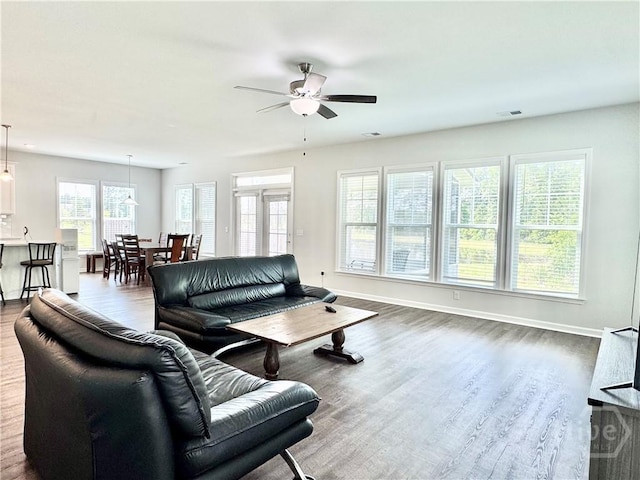 128 Melody Dr, Pooler, GA 31322 - living room featuring a ceiling fan, dark wood-type flooring, and baseboards