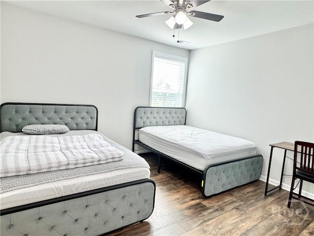 128 Melody Dr, Pooler, GA 31322 - bedroom featuring wood finished floors, a ceiling fan, and baseboards