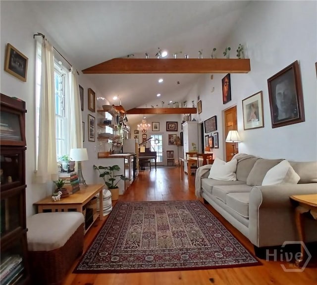 539 E Gwinnett St, Savannah, GA 31401 - living area featuring wood finished floors, a chandelier, high vaulted ceiling, and recessed lighting