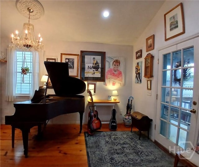 539 E Gwinnett St, Savannah, GA 31401 - sitting room with a chandelier, wood finished floors, baseboards, and vaulted ceiling