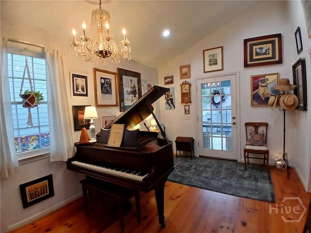 539 E Gwinnett St, Savannah, GA 31401 - sitting room with a chandelier, wood finished floors, healthy amount of natural light, baseboards, and vaulted ceiling
