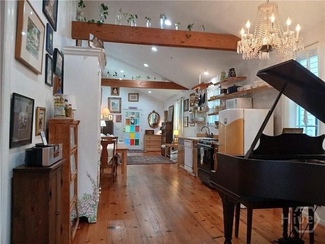539 E Gwinnett St, Savannah, GA 31401 - sitting room with beamed ceiling, wood-type flooring, a chandelier, high vaulted ceiling, and healthy amount of natural light