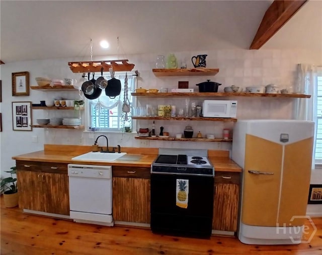 539 E Gwinnett St, Savannah, GA 31401 - kitchen with white appliances, open shelves, a sink, backsplash, and light wood-style flooring