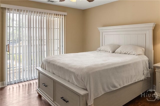 12300 Apache Ave Unit 507, Savannah, GA 31419 - bedroom with dark wood-type flooring, access to outside, a ceiling fan, and baseboards