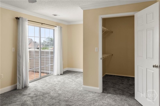 12300 Apache Ave Unit 507, Savannah, GA 31419 - unfurnished bedroom with carpet, access to exterior, crown molding, baseboards, and a textured ceiling