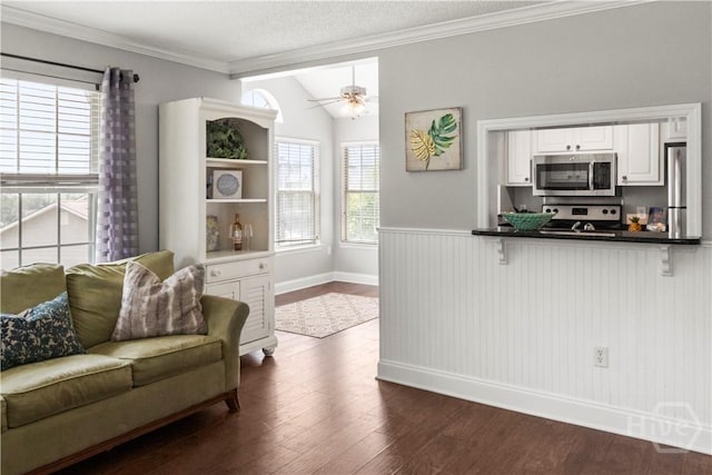 12300 Apache Ave Unit 507, Savannah, GA 31419 - living room with dark wood finished floors, ceiling fan, wainscoting, baseboards, and ornamental molding
