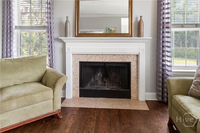 12300 Apache Ave Unit 507, Savannah, GA 31419 - detailed view of wood finished floors, a fireplace with flush hearth, crown molding, and baseboards
