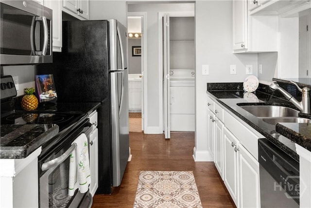 12300 Apache Ave Unit 507, Savannah, GA 31419 - kitchen with stainless steel appliances, a sink, white cabinets, dark wood-style flooring, and dark stone counters