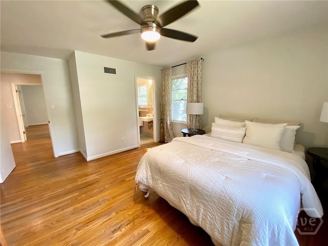 5524 Reynolds St, Savannah, GA 31405 - bedroom featuring light wood-type flooring, baseboards, a ceiling fan, and ensuite bath