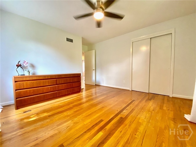 5524 Reynolds St, Savannah, GA 31405 - unfurnished bedroom with wood finished floors, a closet, and baseboards
