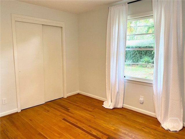 5524 Reynolds St, Savannah, GA 31405 - unfurnished bedroom featuring wood finished floors, baseboards, and a closet